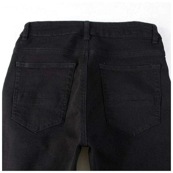 White patch ripped biker jeans